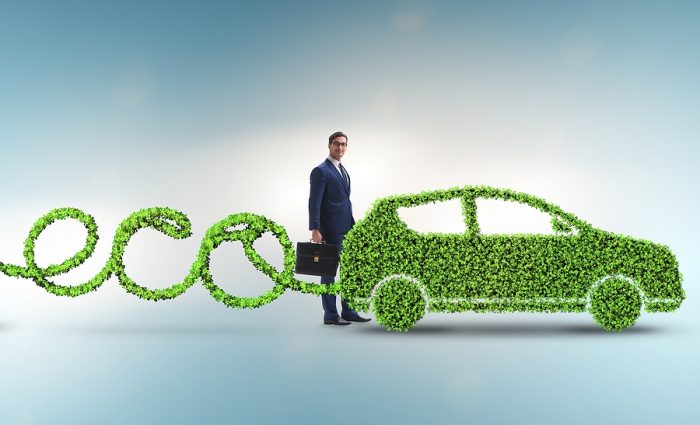 eco-friendly car green mobility man in suit with suitcase